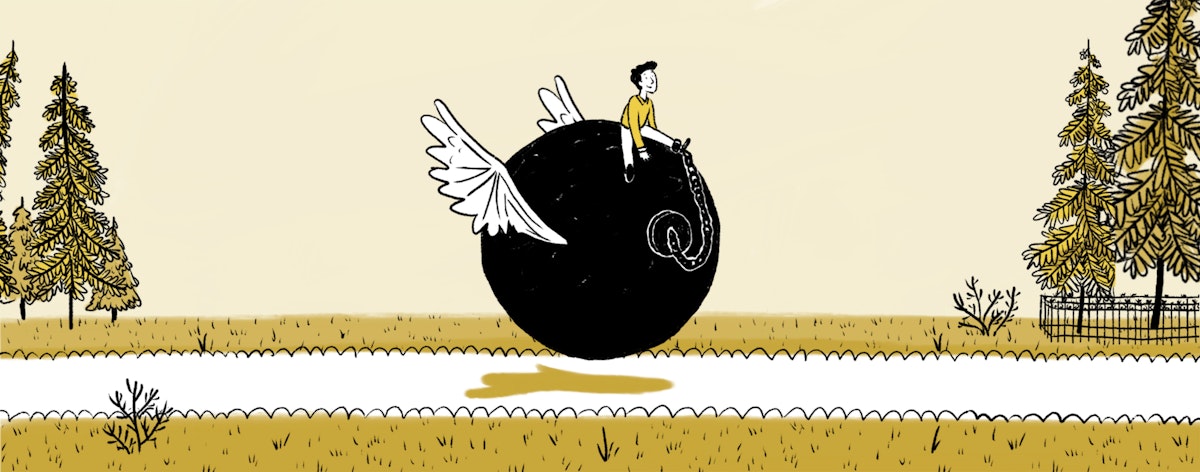A man rides on top of a ball and chain with wings.