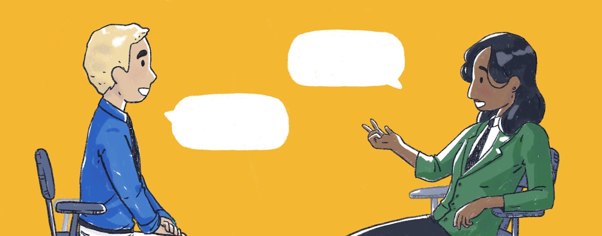 An employer talks to a younger employee.